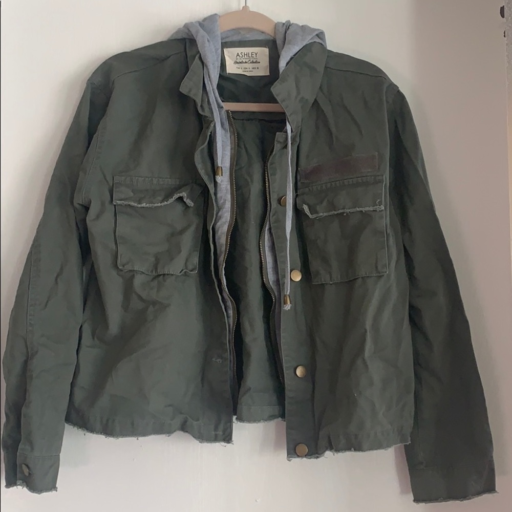 Green denim jacket with a hood.